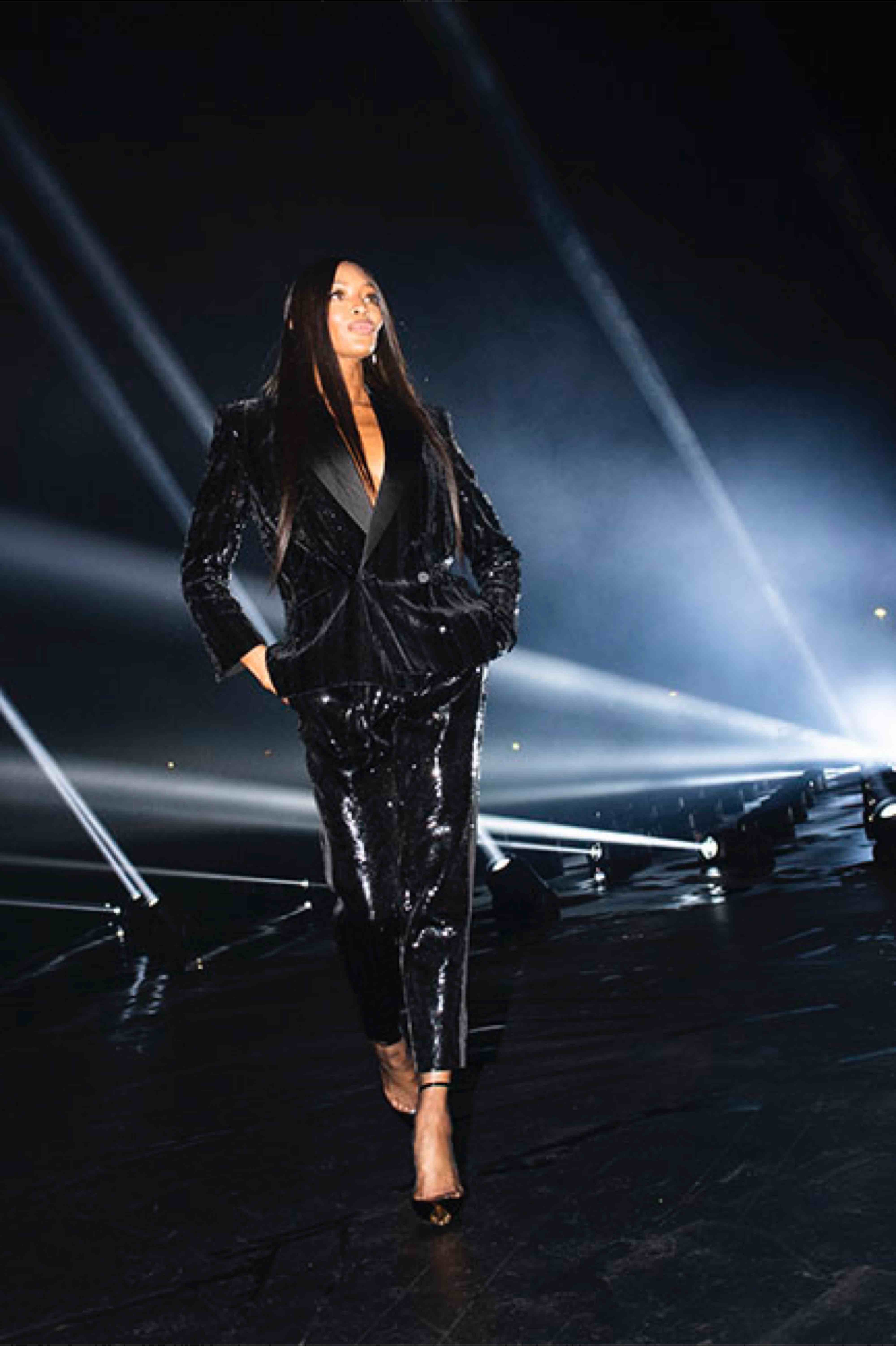 Model Naomi Campbell walks the runway at the Saint Laurent SS20 show shot by Jasan Lloyd Evans.