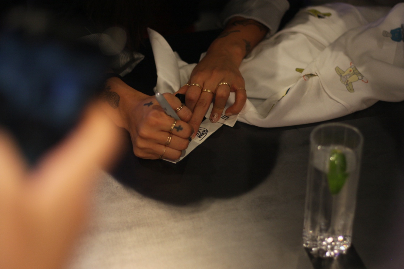 Peggy Gou signing exclusive shirt from the Kirin collection
