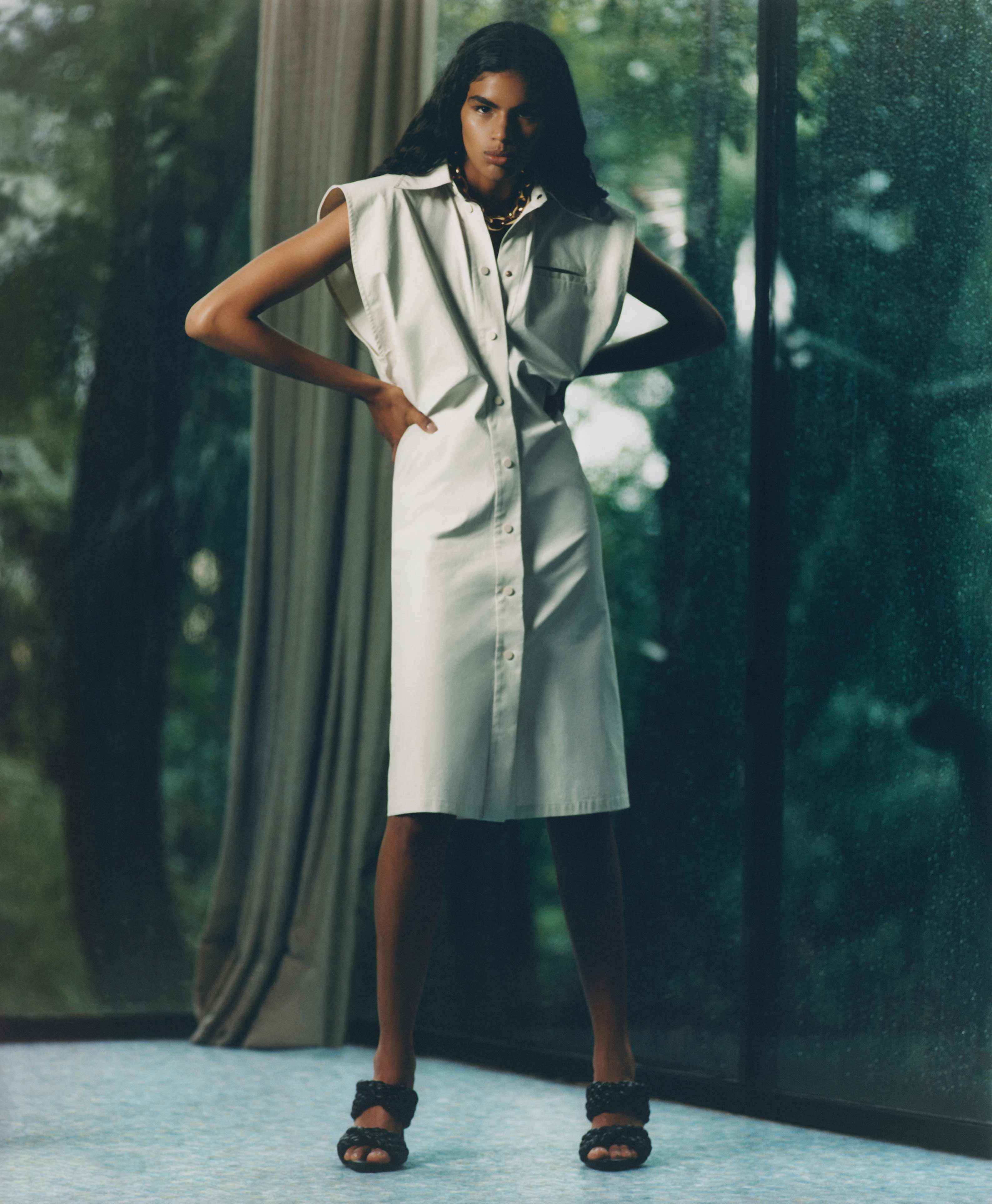 Bottega Veneta white dress in Casa de Vidro by Lina Bo Bardi