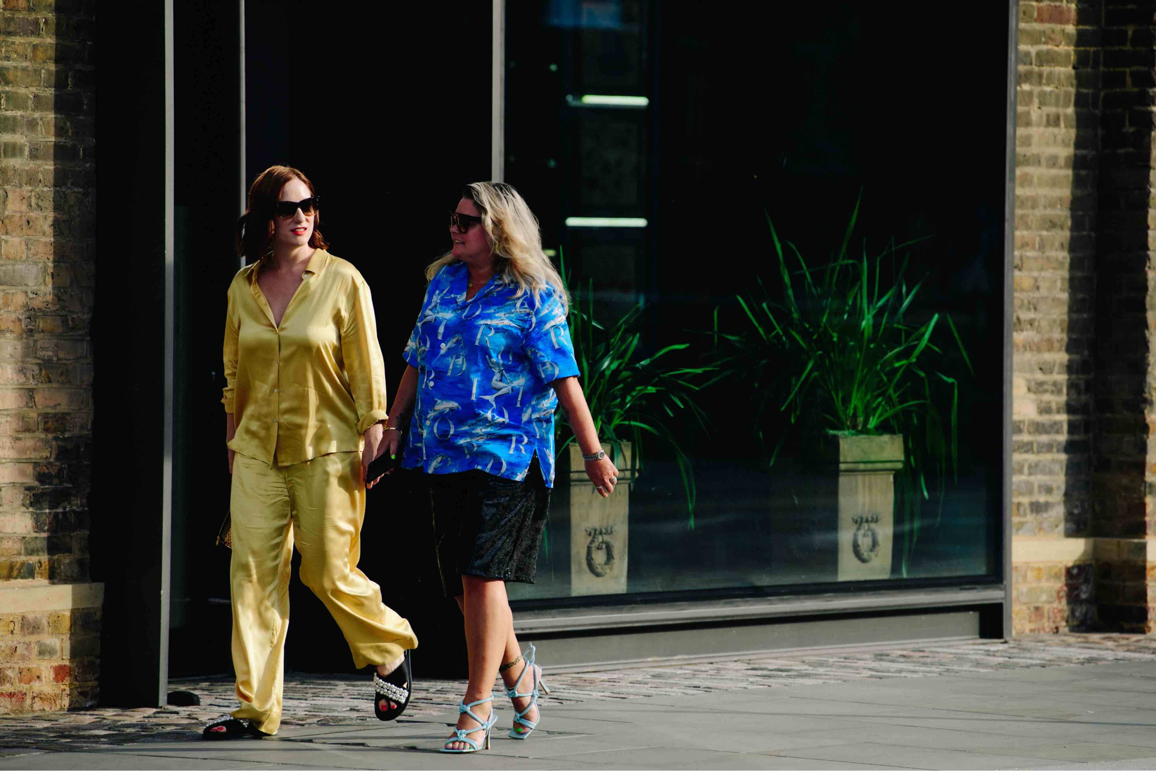 Browns buying director Ida Petersson wearing Dior and Bottega Veneta, and visual experience director Katie Butcher wearing Asceno shot by photographer Adam Katz Sinding