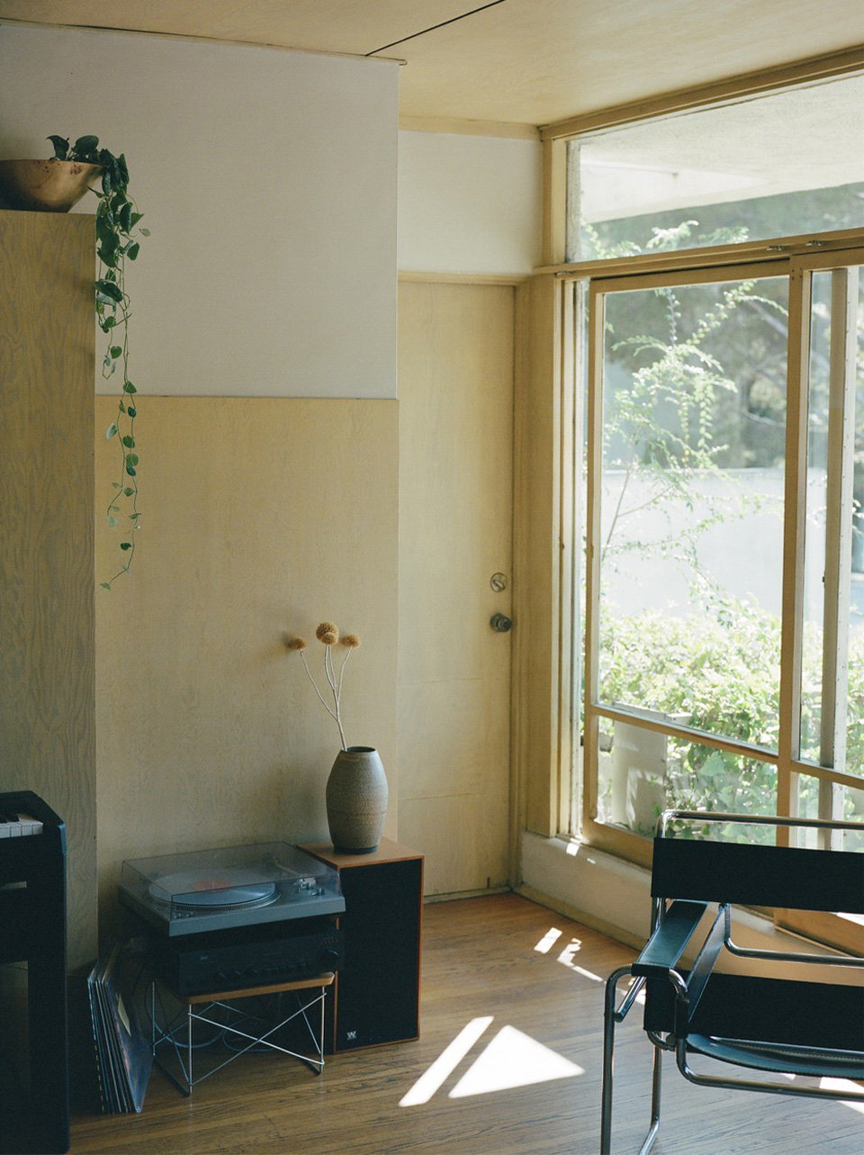 “My living room with morning light - one of the nicer corners of our Schindler apartment.”