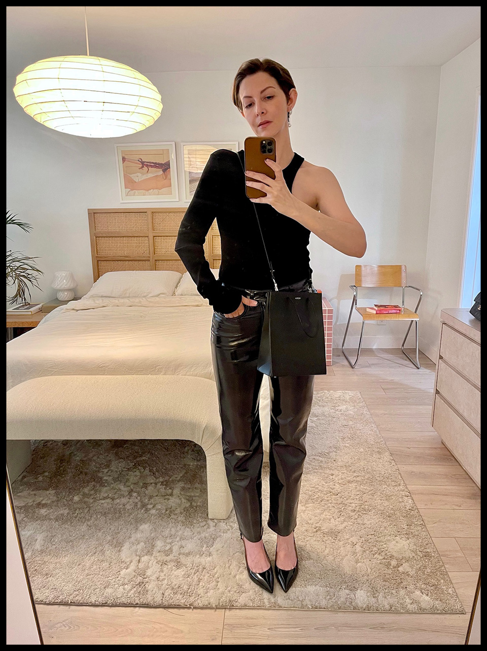 24 Hours With… AGOLDE’s Erin Meehan “Heading out to karaoke with friends wearing the Bea Cutaway top and Recycled Leather Pinch Waist ‘90s fit pants.”